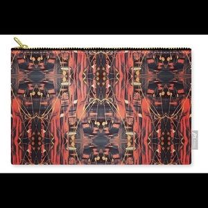 Hand painted textiles put onto zipper pouches